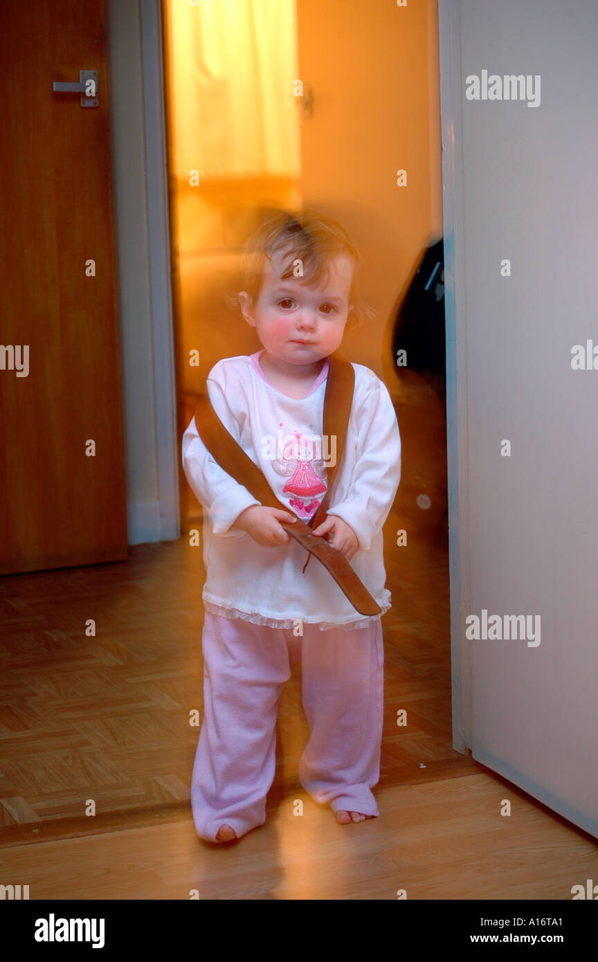 Young girl standing in doorway Stock Photo - Alamy