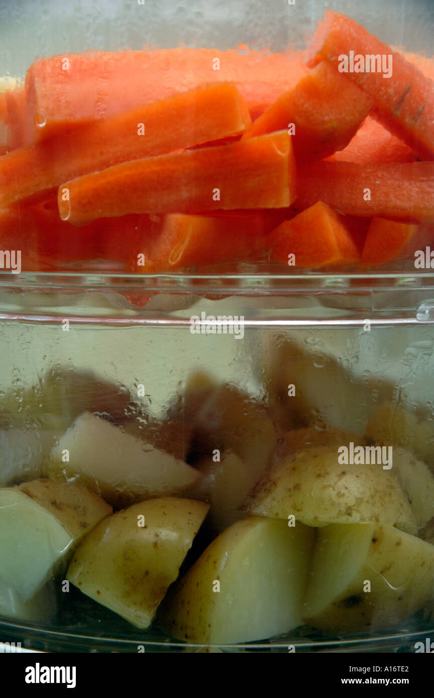 Vegetables cooking in an electric steamer Stock Photo Alamy