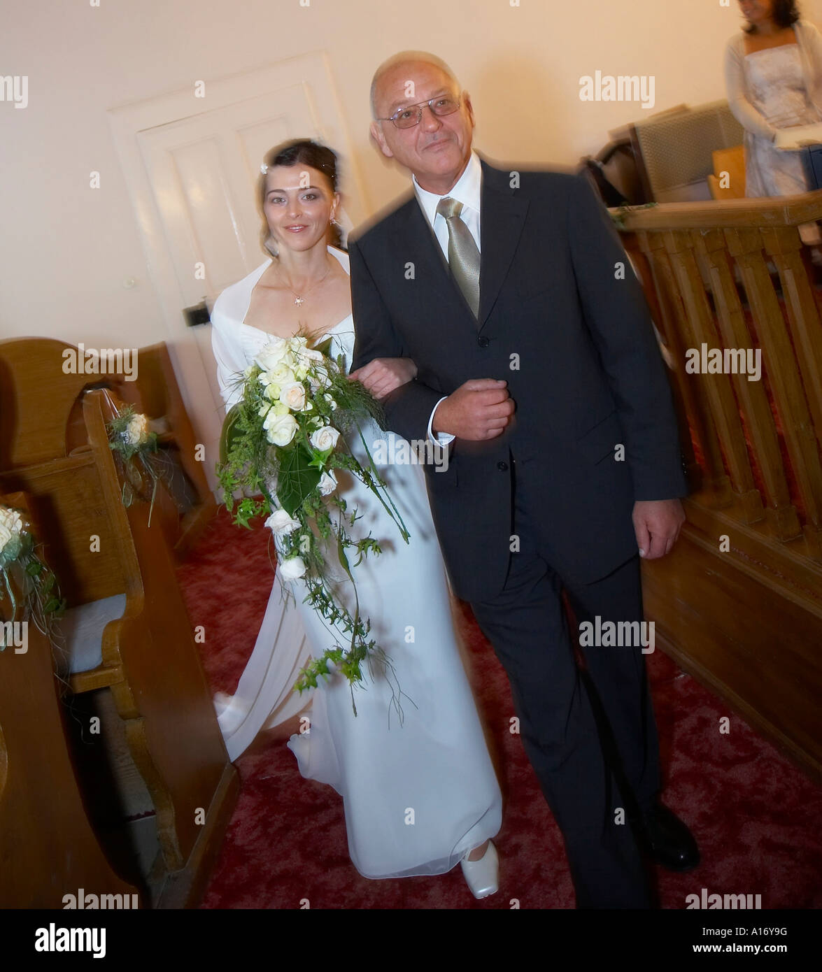 bride with father, entering church Stock Photo