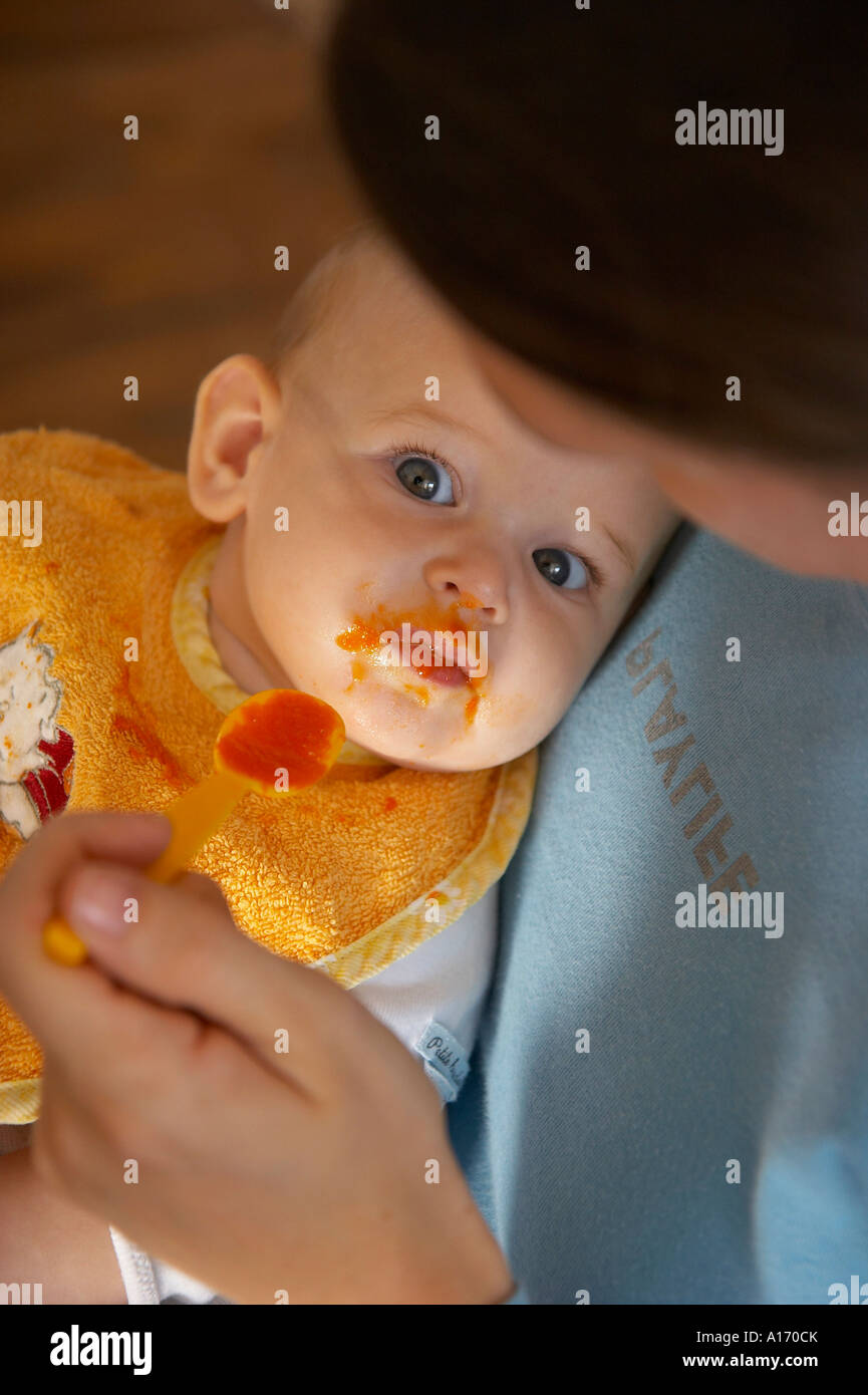 baby eating carrot mash Stock Photo Alamy