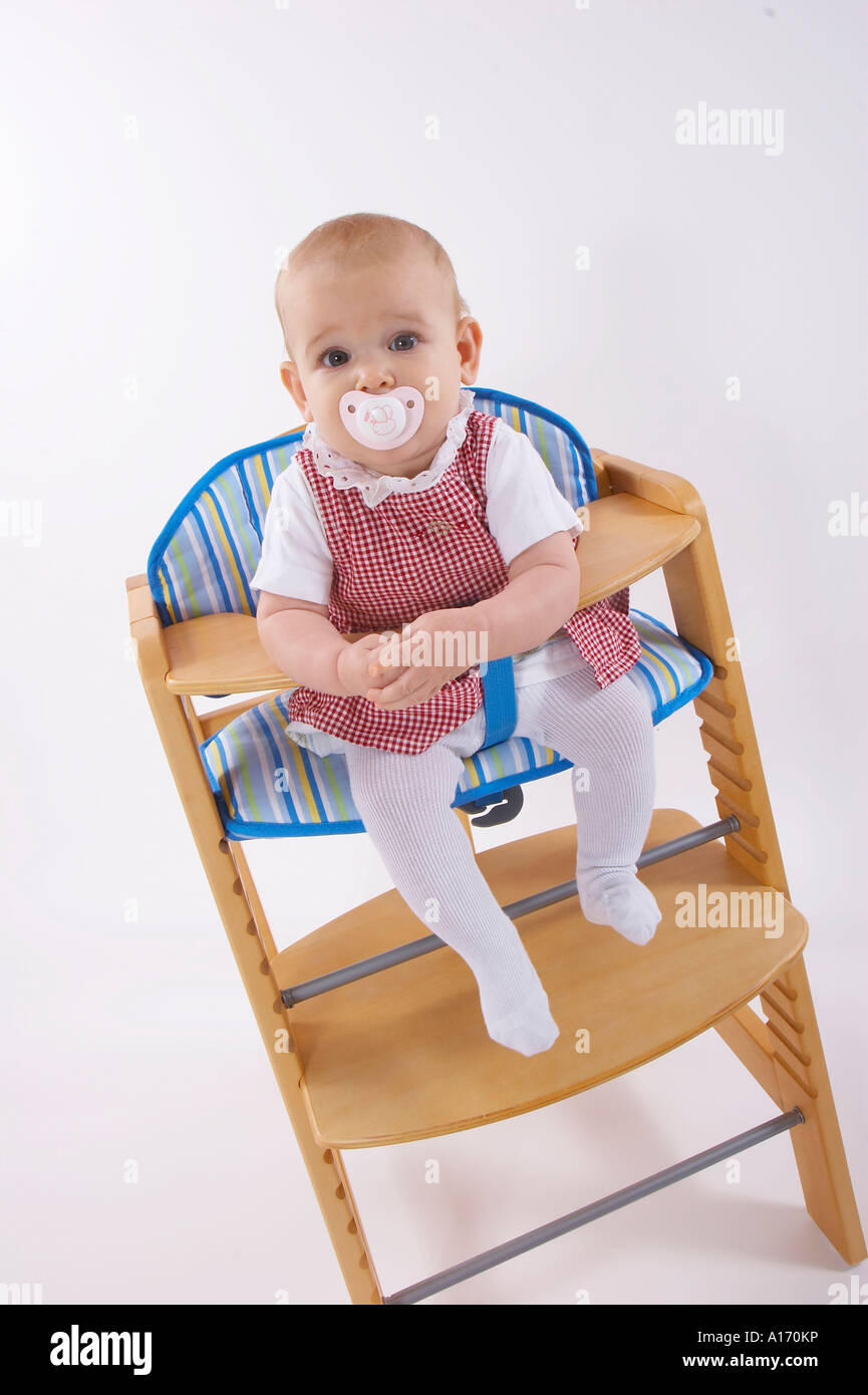 baby sitting in child seat Stock Photo