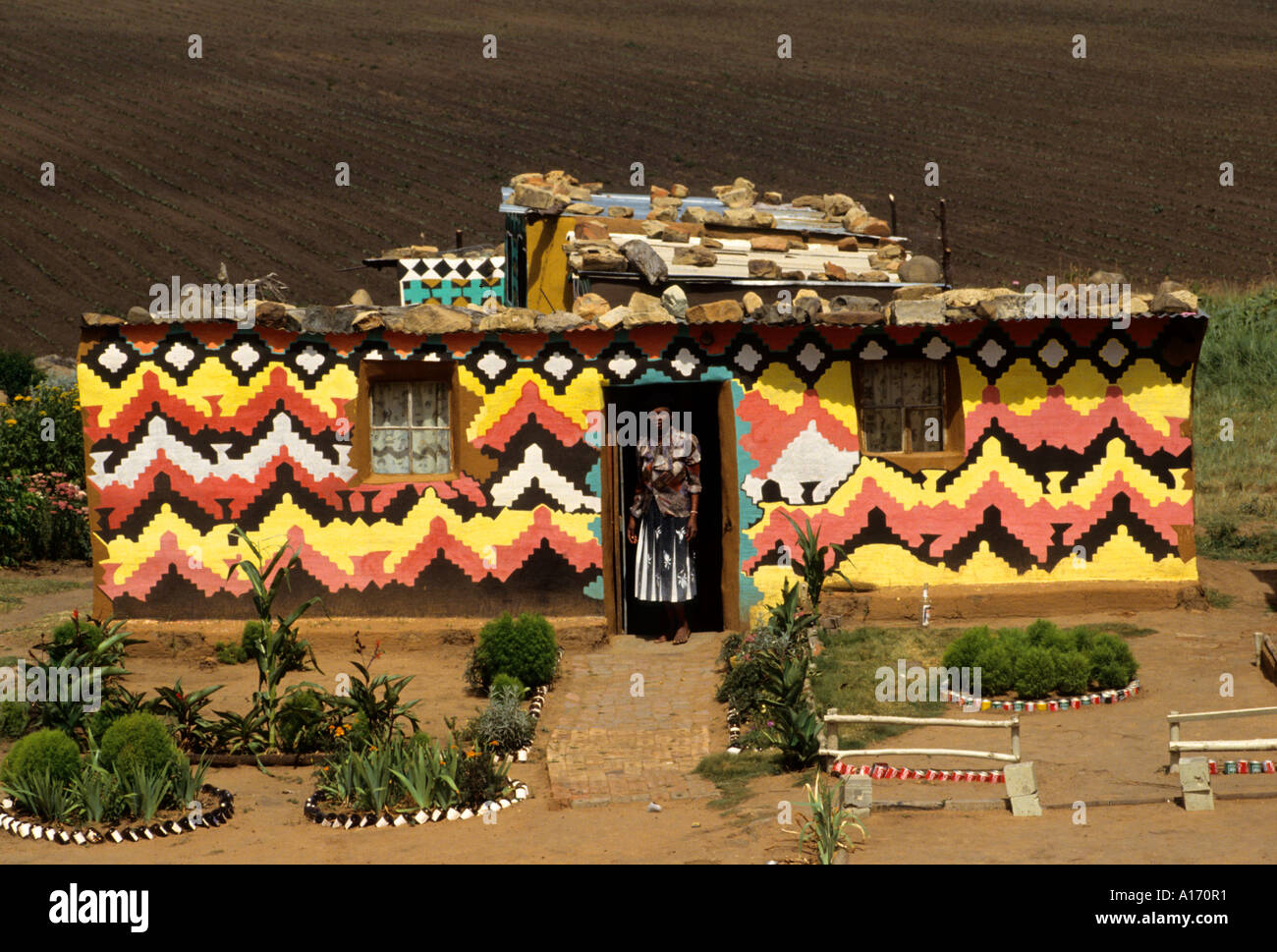 South Africa Ndebele house Orange Free State woman Stock Photo