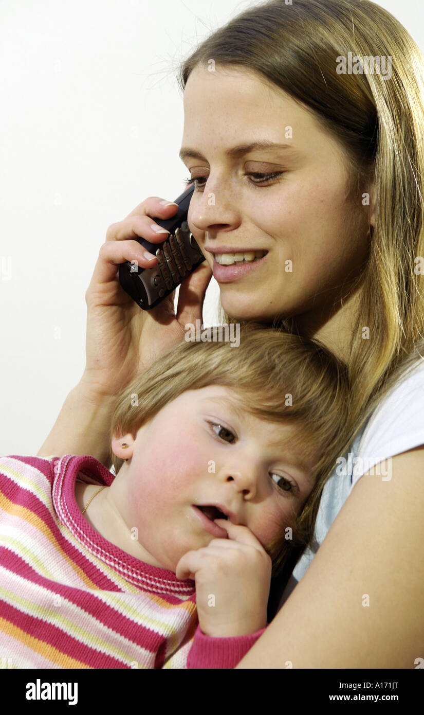 mother with child and mobile phone Stock Photo