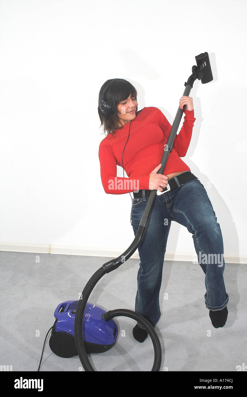 lady with a vacuum cleaner Stock Photo