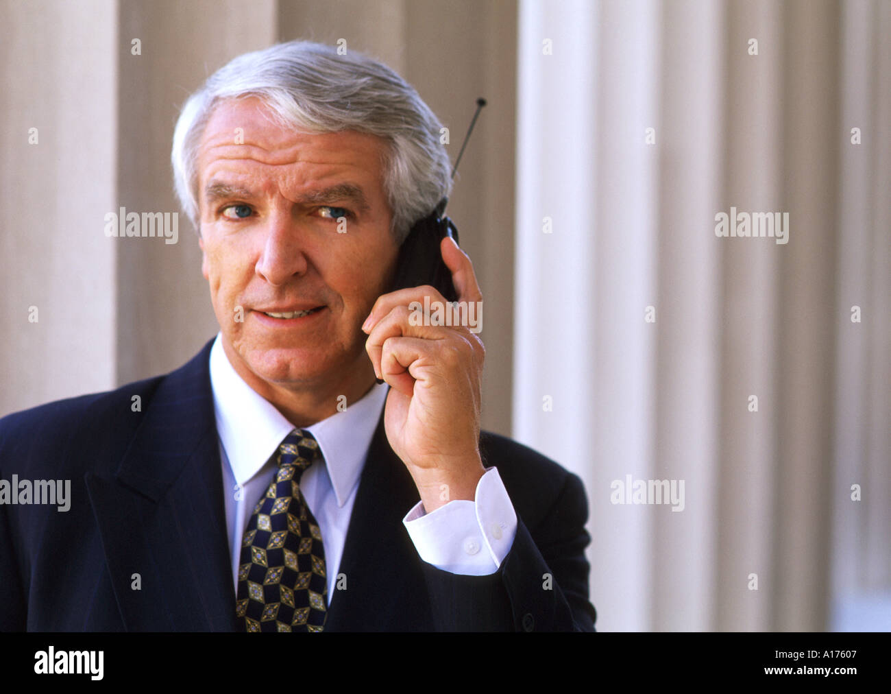Senior businessman using cellular phone Stock Photo