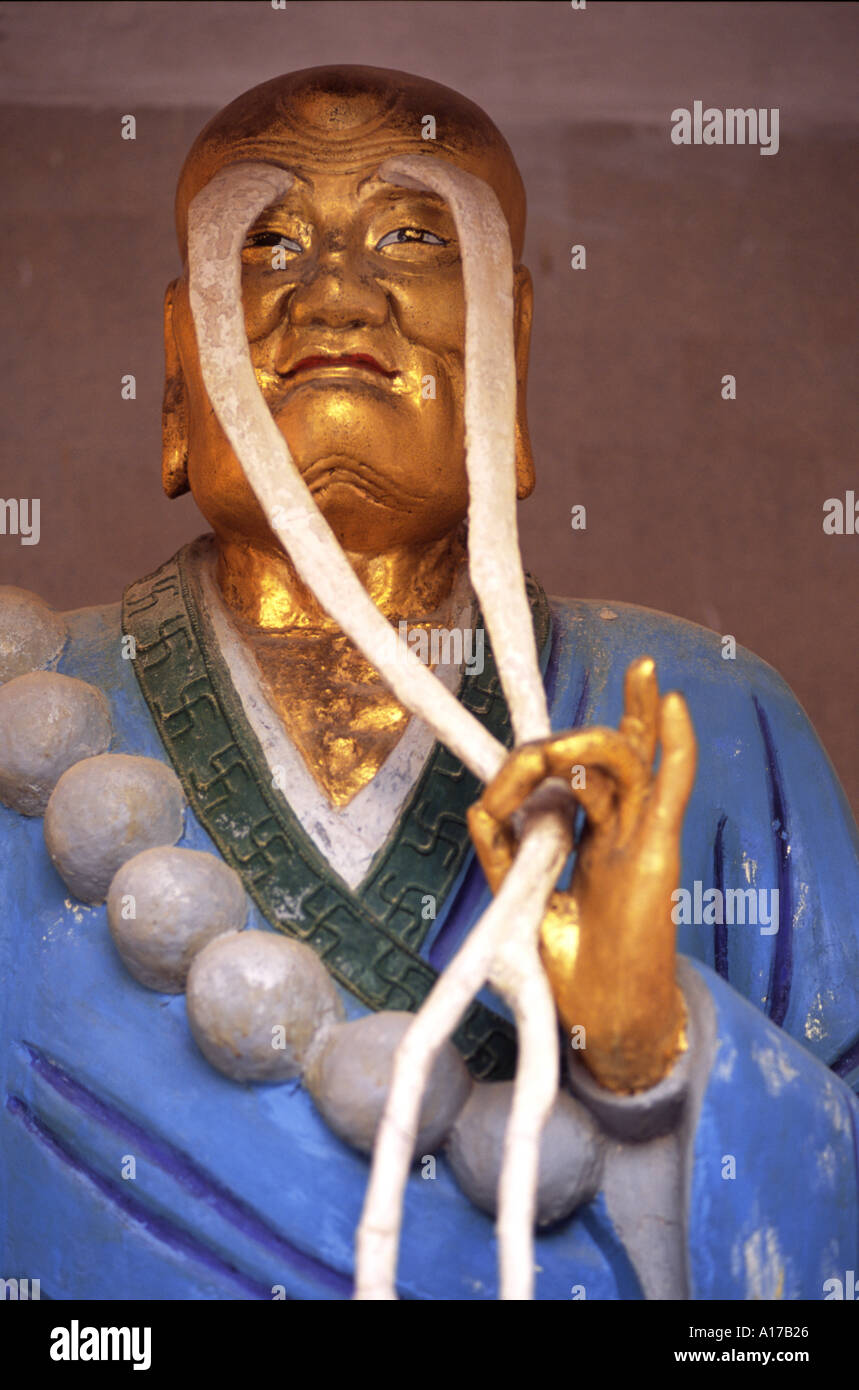 Portrait of sacred monk with very long eyebrows statue at the 10000 Buddha Monastery in Hong Kong Stock Photo