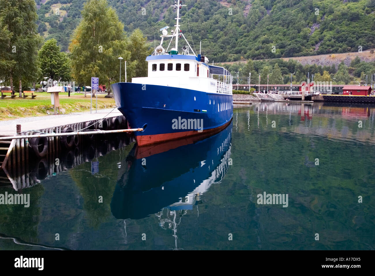 Fjord sightseeing boat anchored in marina at Flam Norway Stock Photo