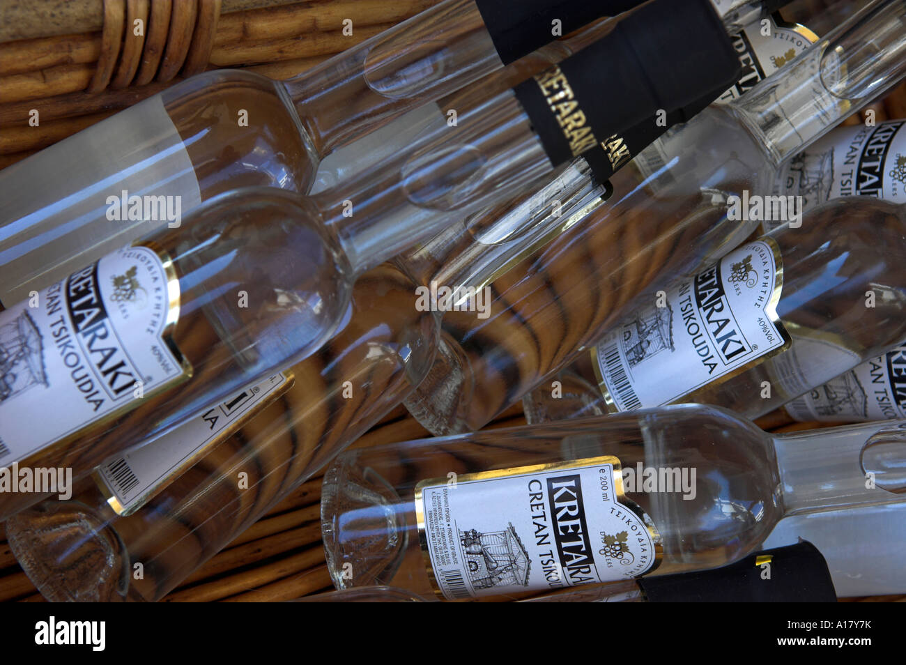 Random pile of the clear wine based liquor bottles of Cretan Kretaraki