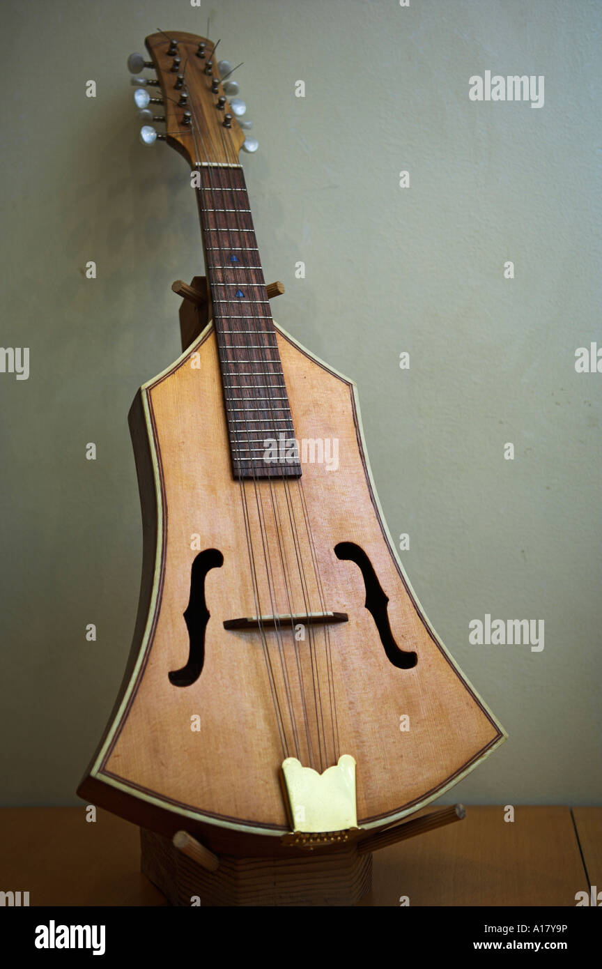 Cretan ten stringed guitar displayed in stringed instrument shop Stock