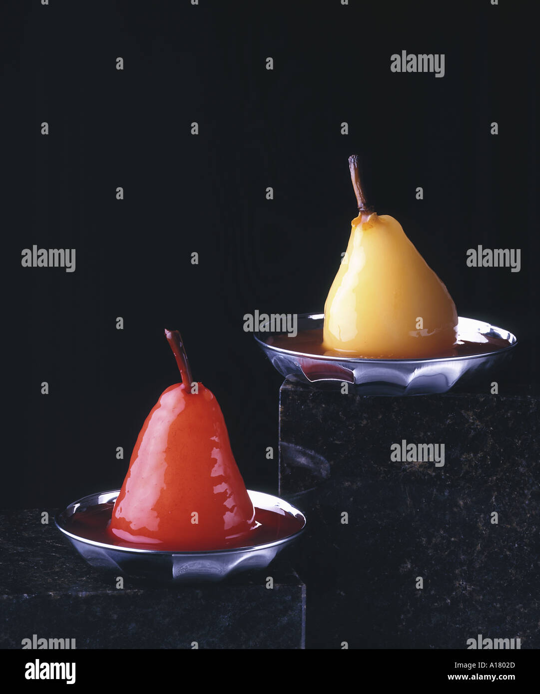 MARINATED PEARS IN SILVER BOWLS Stock Photo