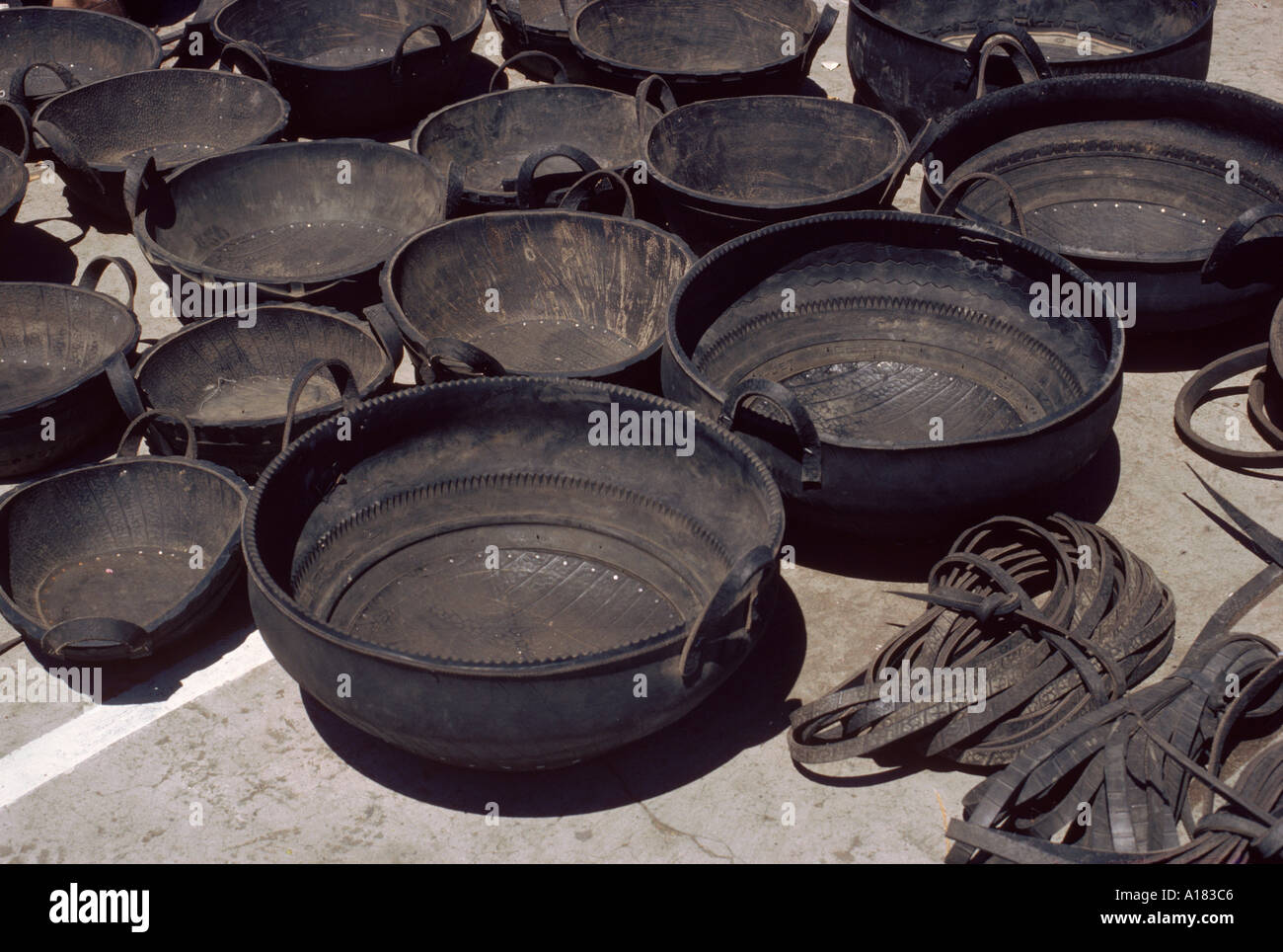 A selection of buckets made from recycled tyres for sale at Pujilo