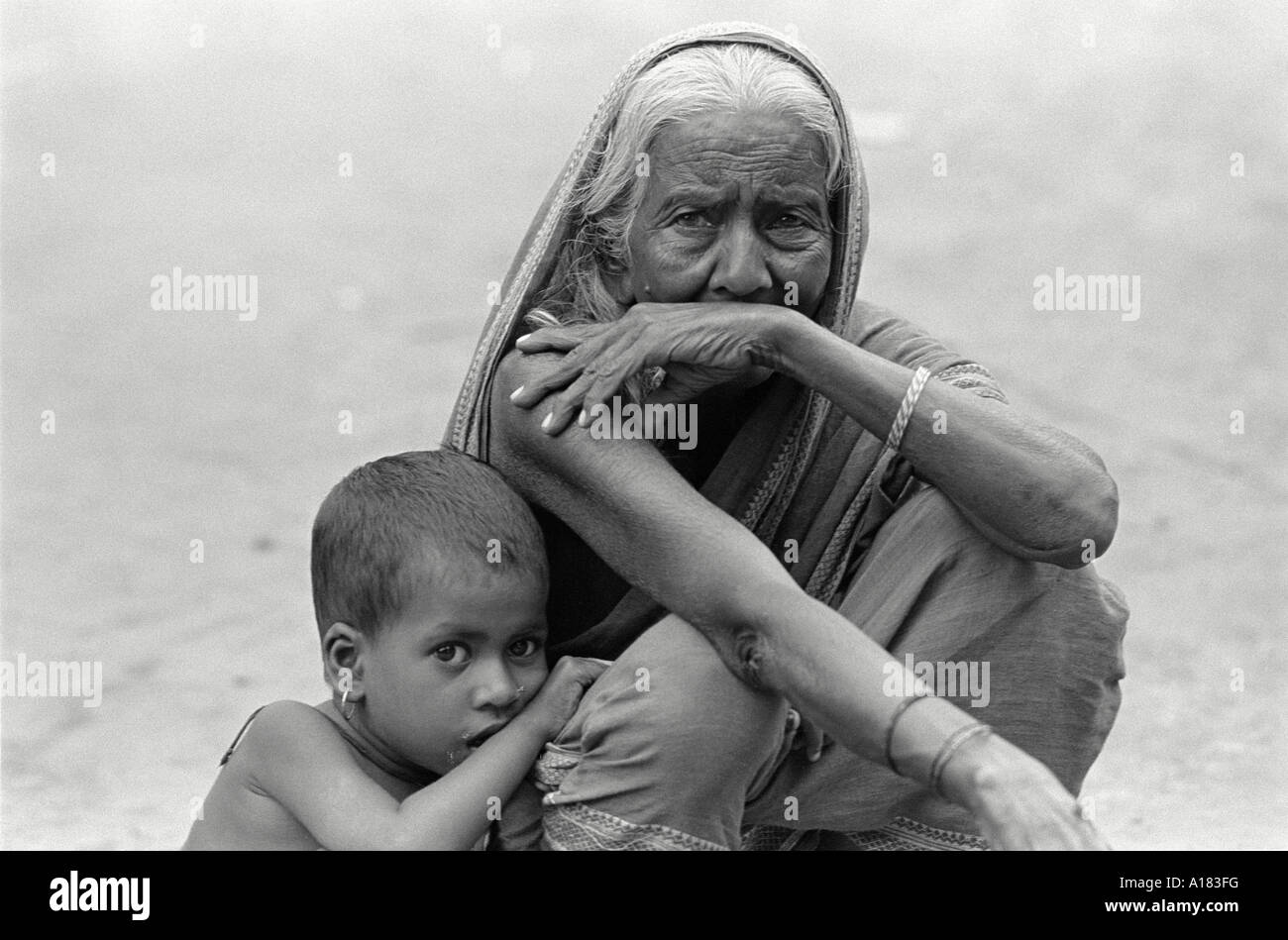 B/W portrait of an elderly woman with her grandson from a farming village near Tangail, Bangladesh Stock Photo