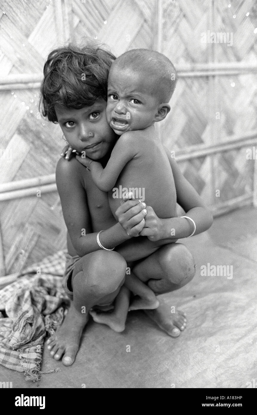 B/W of children at an emergency rural health clinic and feeding centre for sick and malnourished children. Noapara, Nr. Kolkata, West Bengal, India Stock Photo