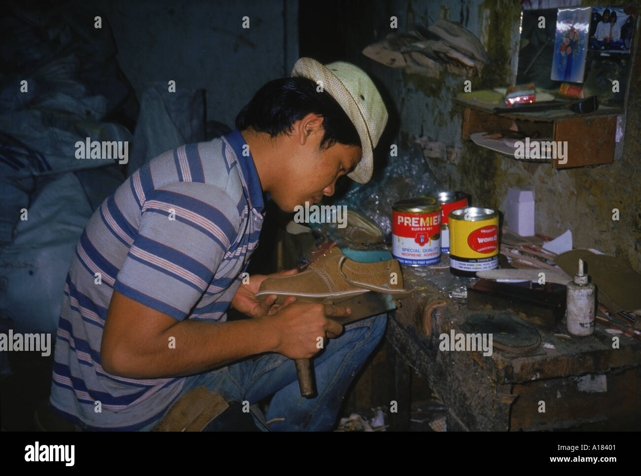 Portrait of a man making shoes in a factory in Chiang Mai Thailand Asia N Blythe Stock Photo