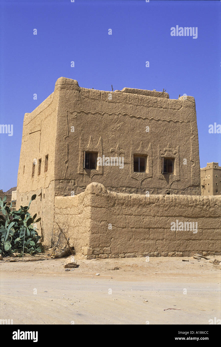 Mud built fortress house with decorated windows Farawah north Yemen