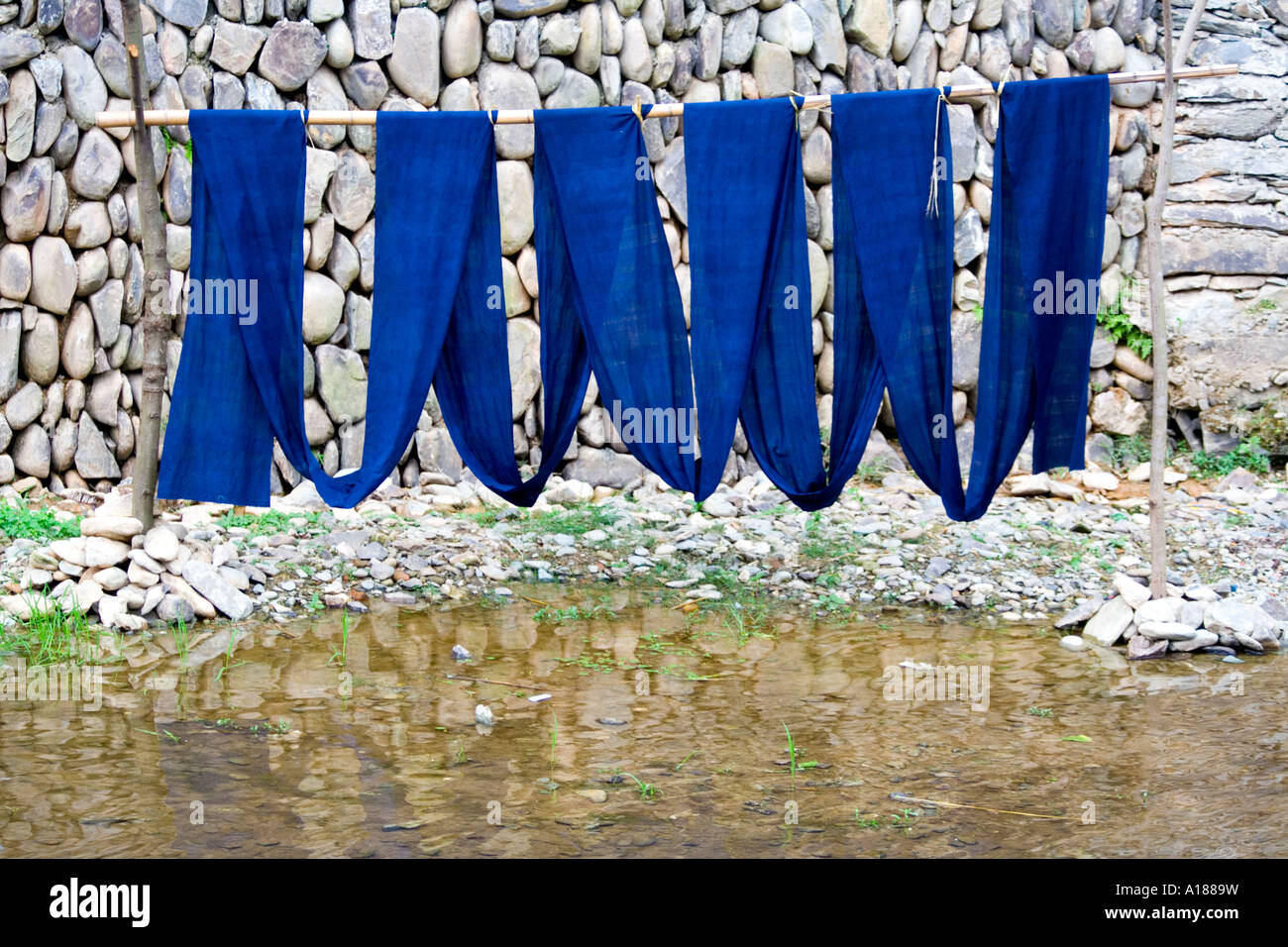 Indigo Fabric Hung to Dry after Dying, Zhaoxing, China Stock Photo