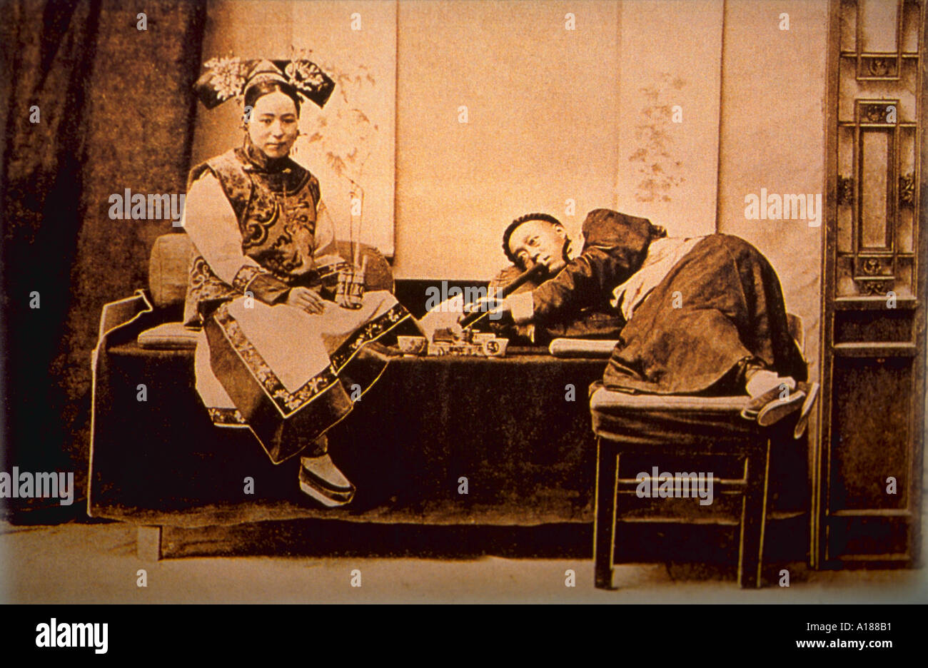Chinese couple smoking opium in 1887 China Stock Photo