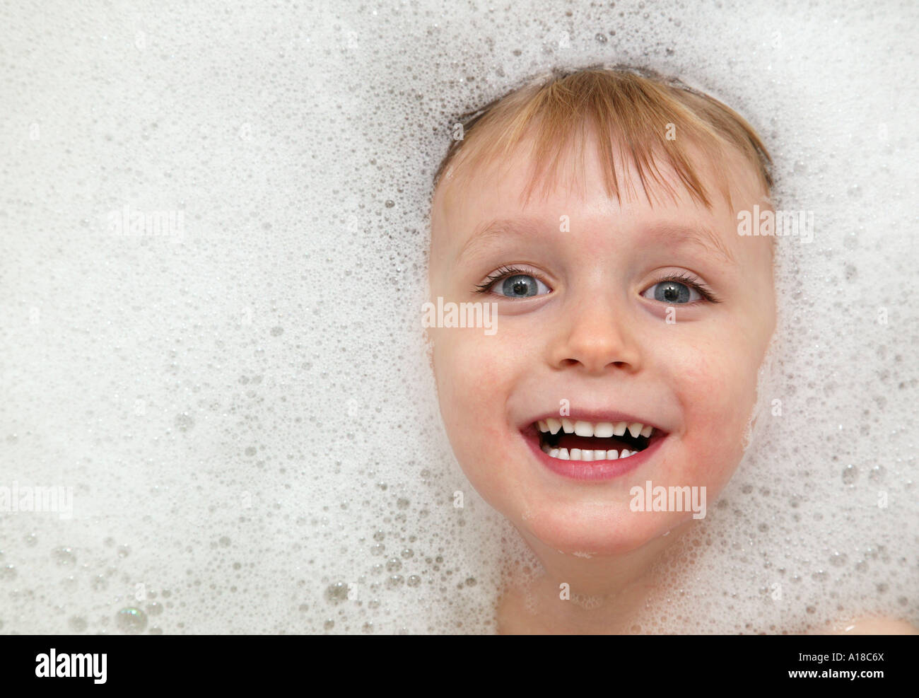 A toddler enjoying bubbles in the bath Stock Photo Alamy