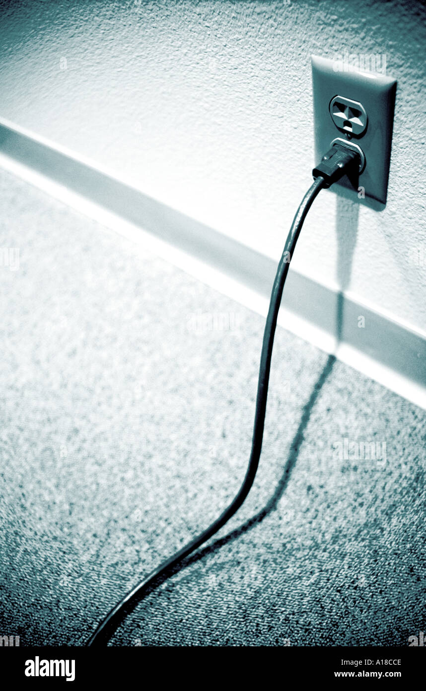 Power cord plugged into wall socket Stock Photo Alamy