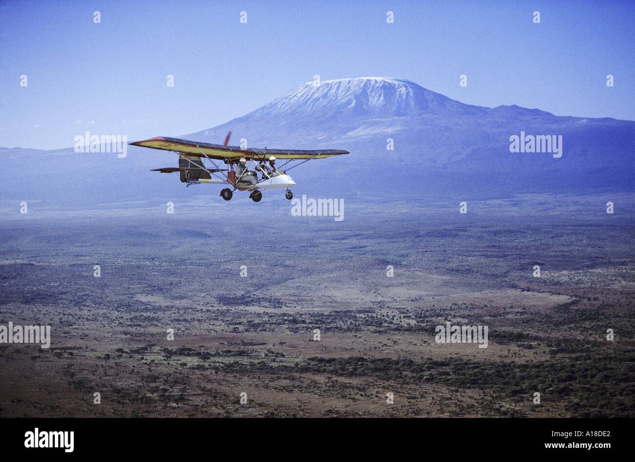 Microlight with Mt Kilimanjaro in background Kenya Stock Photo