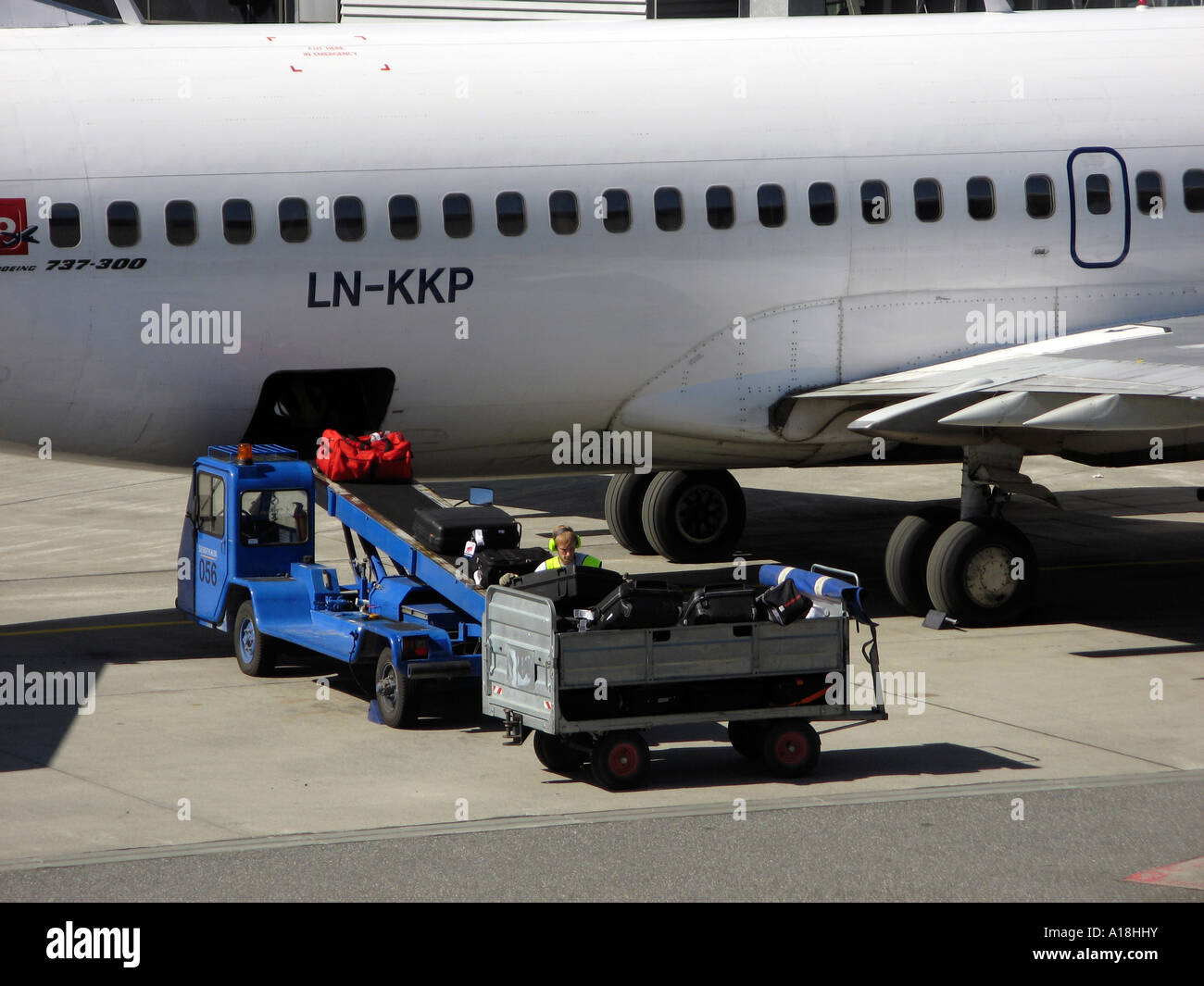 Loading baggage into air plane at Oslo Airport Gardermoen, OSL, located in Ullensaker, Norway Stock Photo