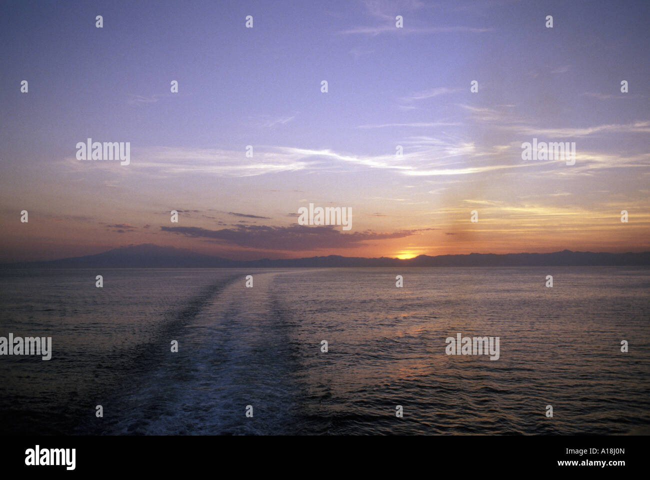 a view from the back of a cruise ship at sunset Stock Photo - Alamy