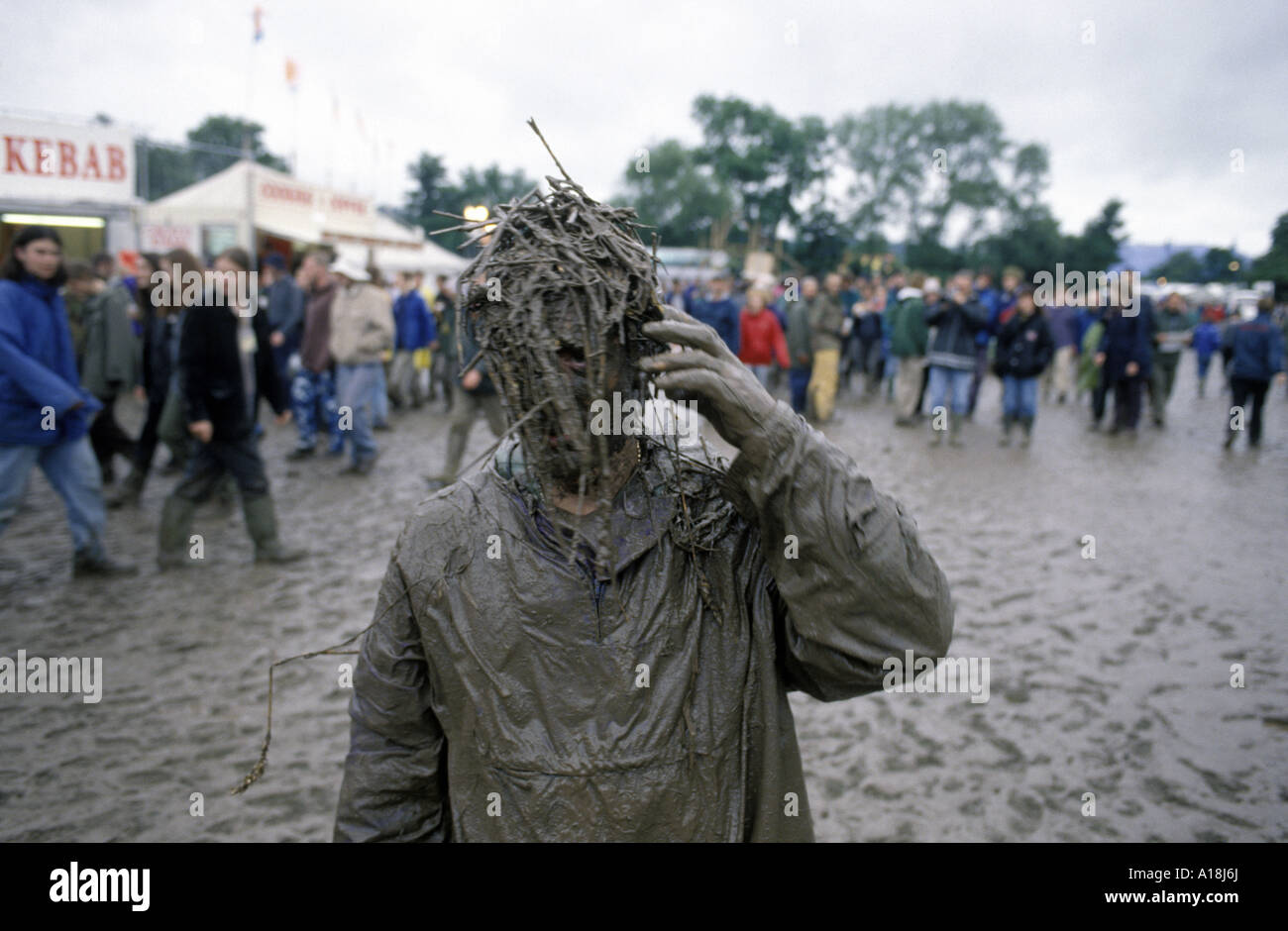 man covered in mud at the Glastonbury Festival Stock Photo - Alamy