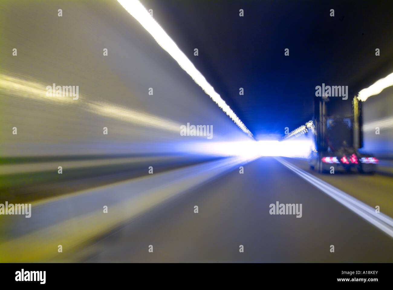 Cars Trucks & Lorries Speeding On Highway And Through Tunnel, USA Stock Photo