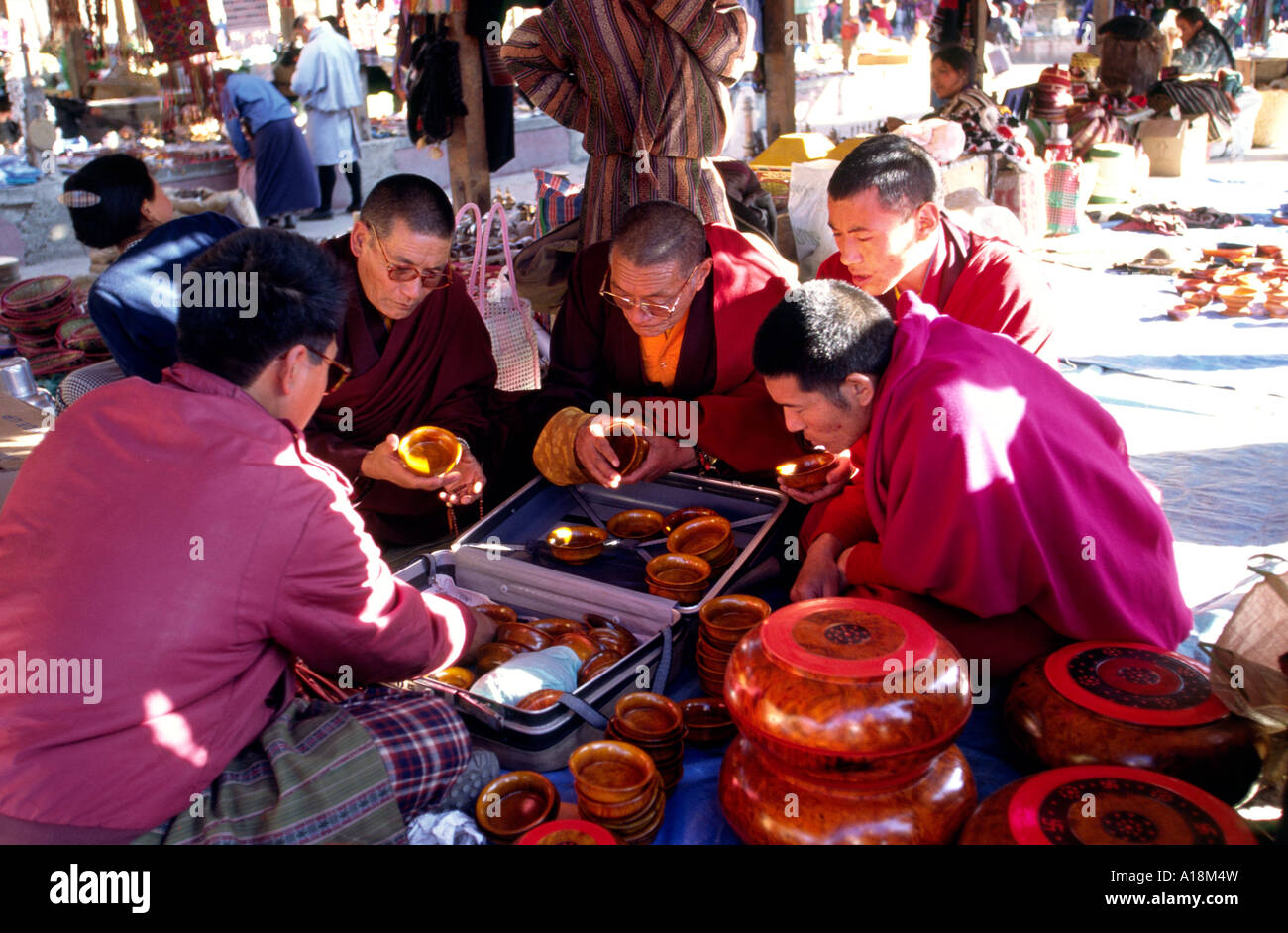 Bhutan Thimpu weekend market monks at bowl stall Stock Photo