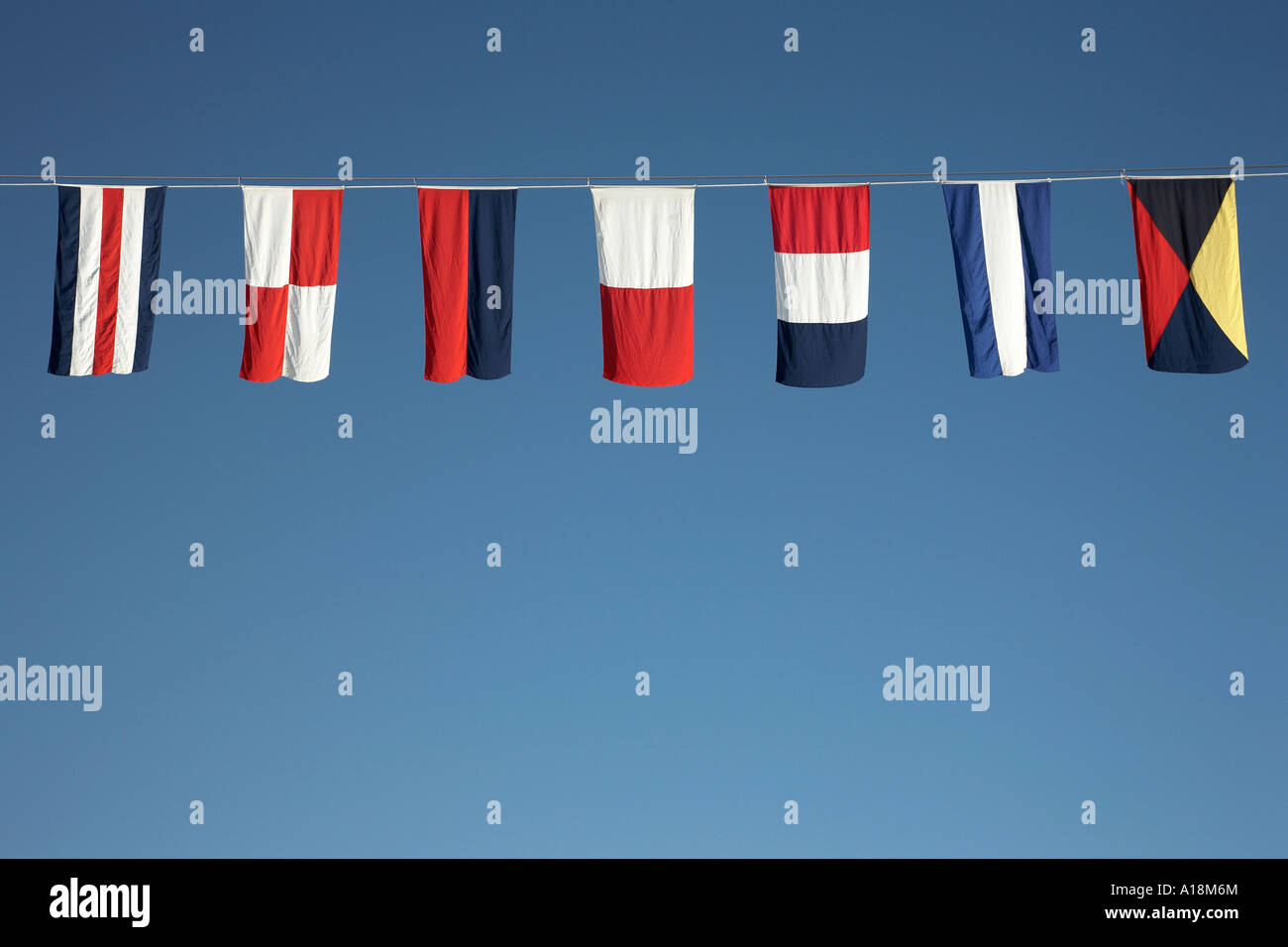 nautical flags strung along the line of a cruise ship Stock Photo Alamy