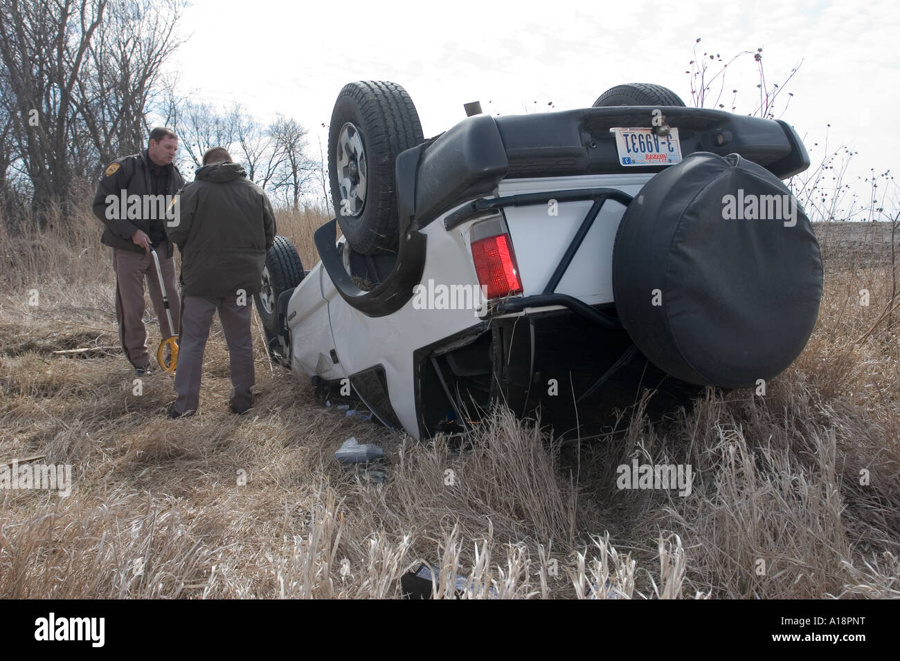Traffic accident on rural road. High winds toppled the SUV. Rollover