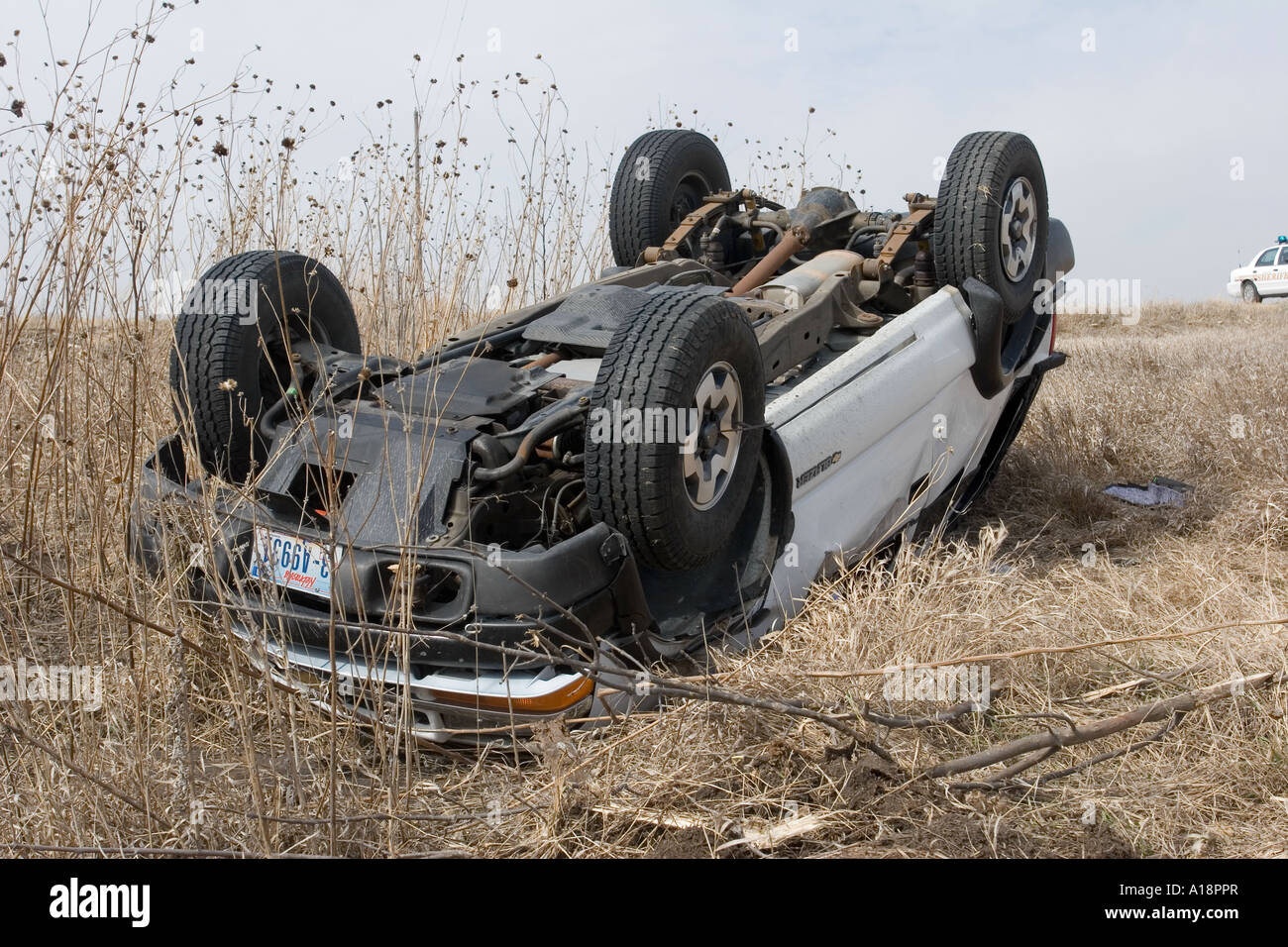 Traffic accident on rural road. High winds toppled the SUV. Rollover