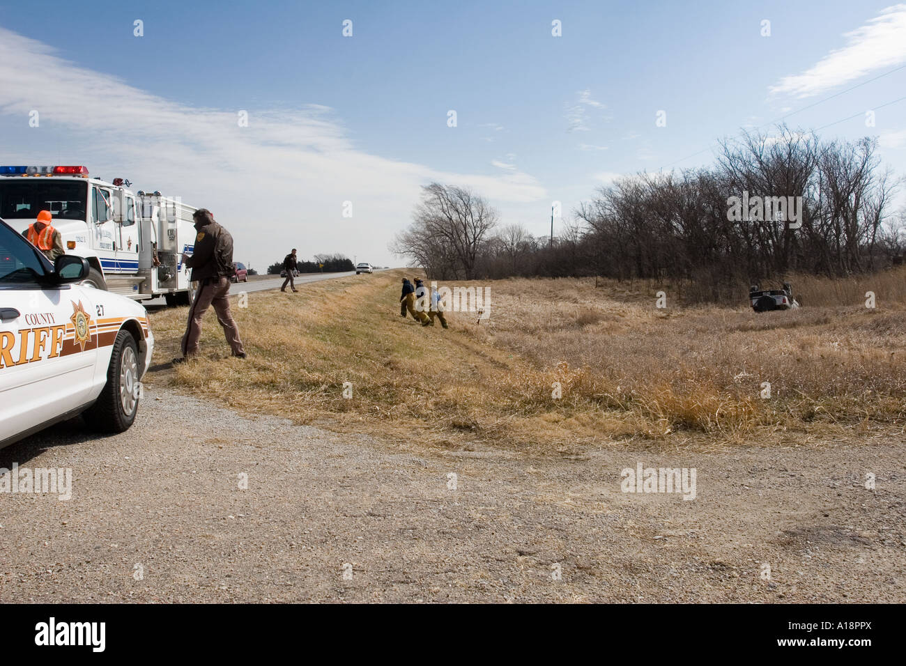 Traffic accident on rural road. High winds toppled the SUV. Roll-over accident. Rural nebraska, USA. Stock Photo