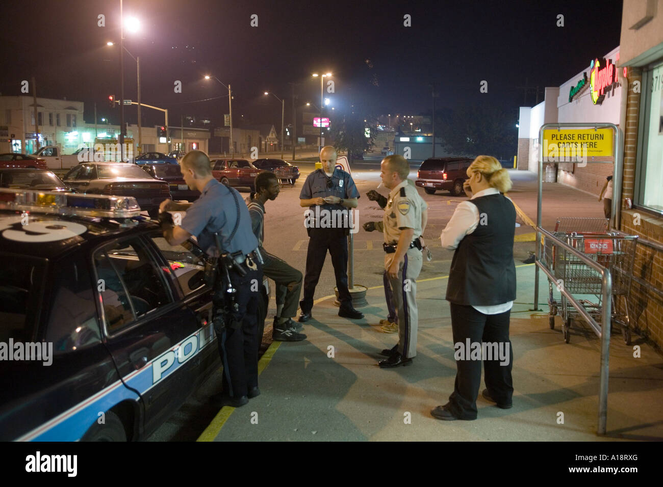 Police officer dealing with a suspect that had been trespassing inside ...