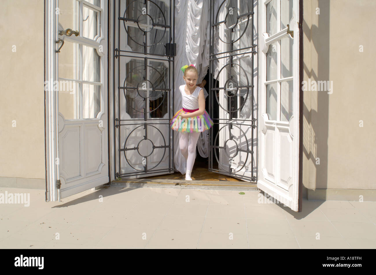 A Young Polish Ballet Dancer Running Out Of An Open Door At A