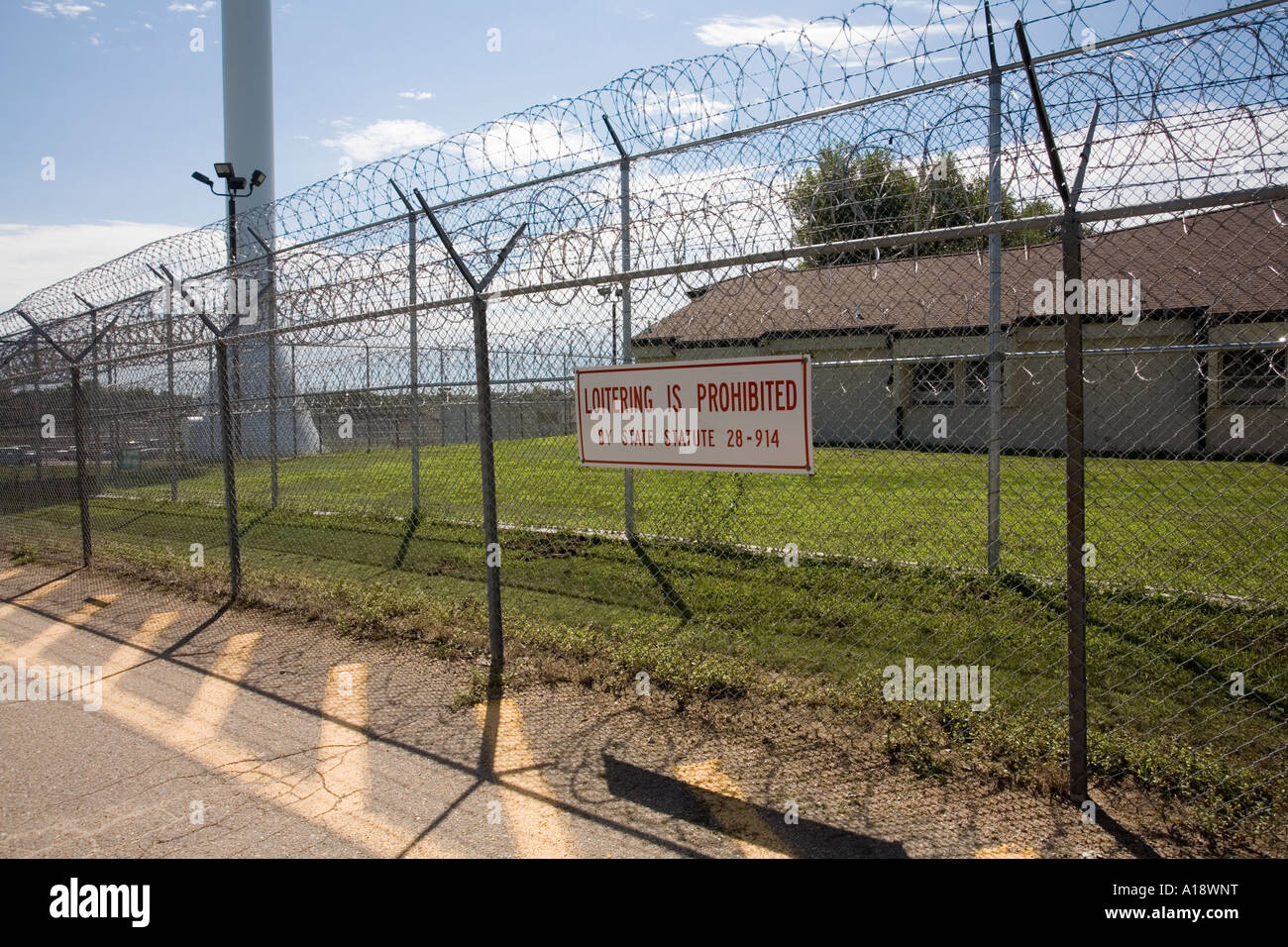 Perimeter fence and water tower.  Nebraska Correctional Center for Women in York Nebraska USA. Stock Photo