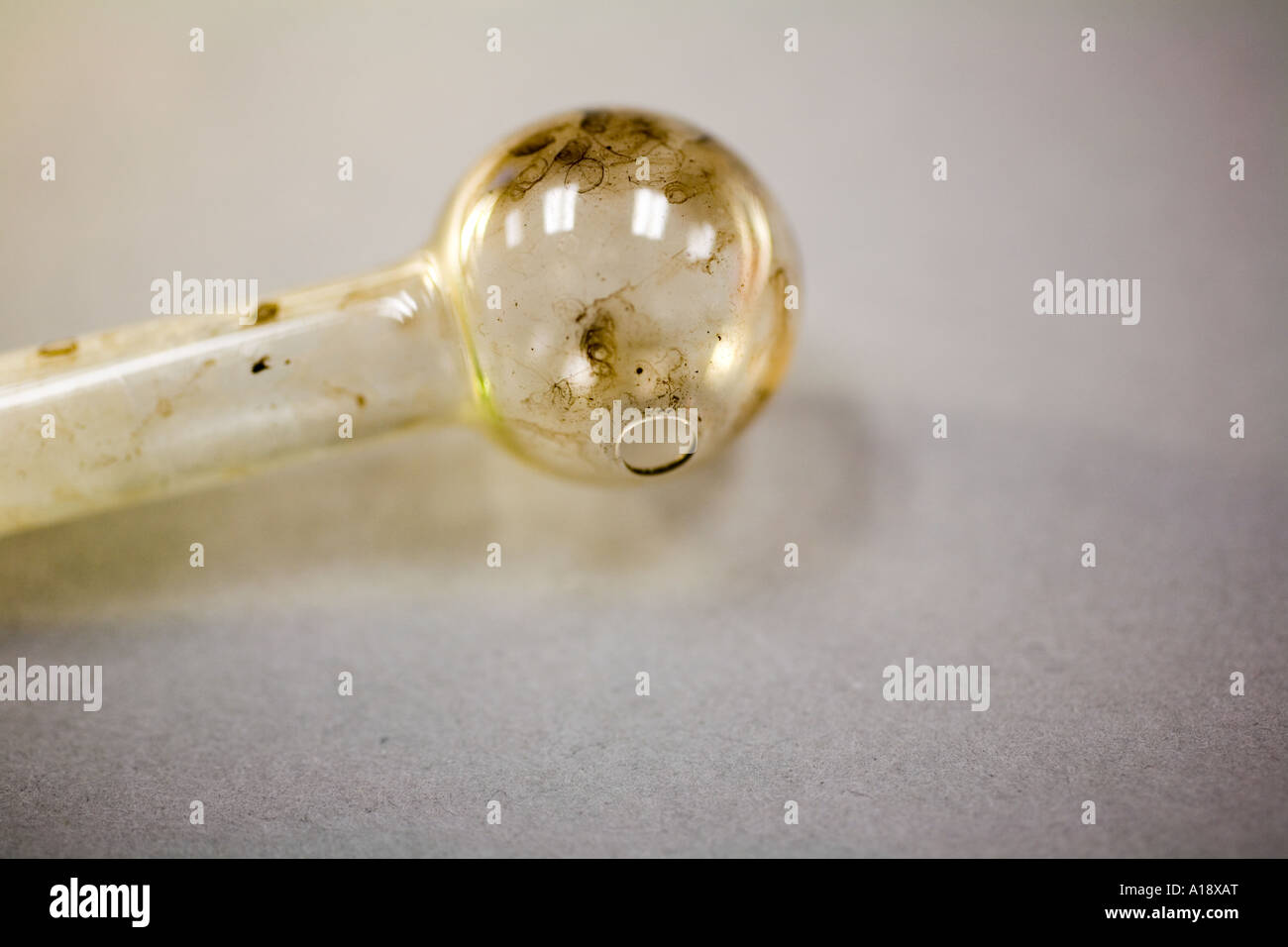 Glass pipe located during search warrant. The pipe have been used to smoke meth amphetamine. Stock Photo