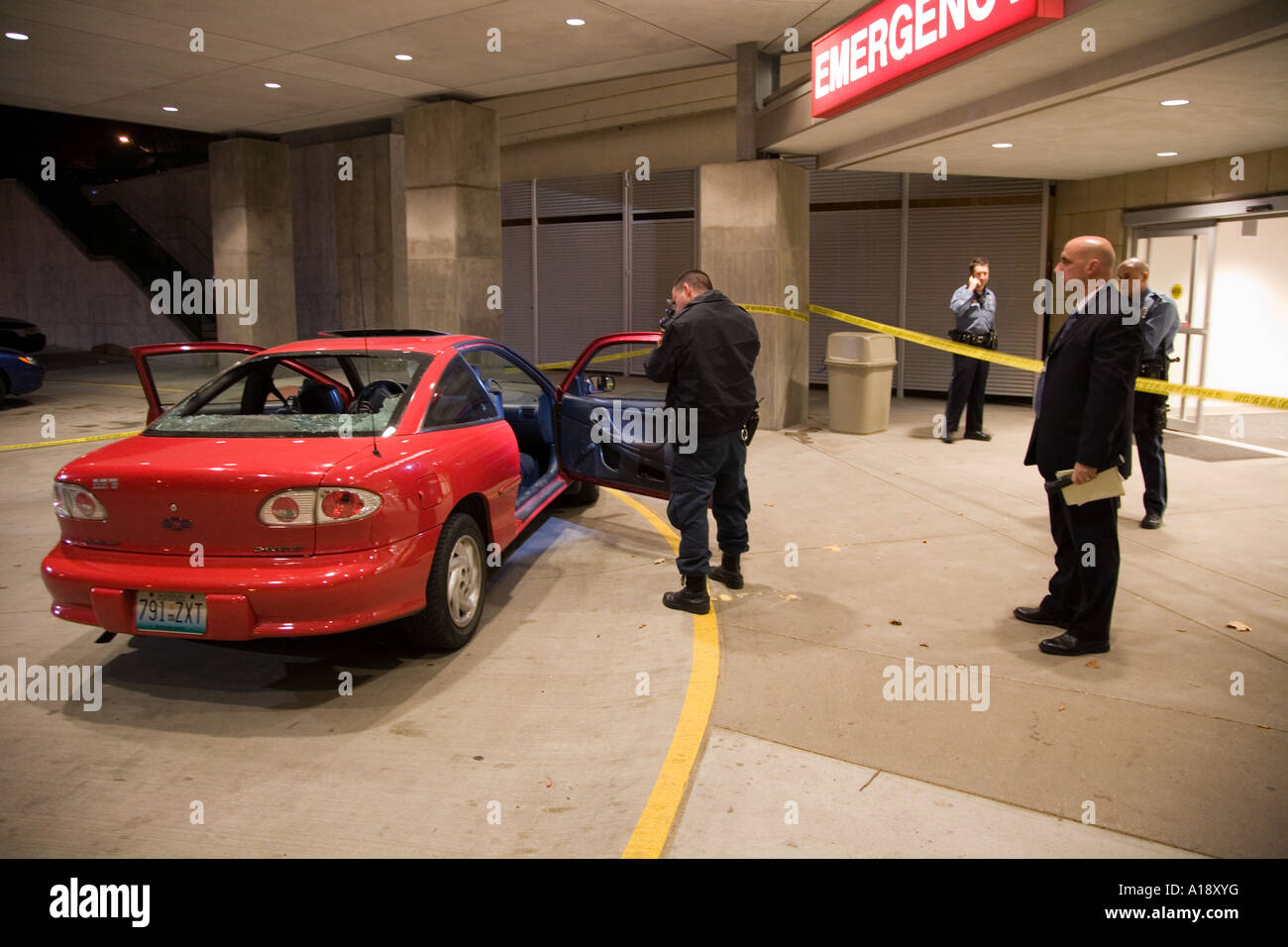 Crime Scene Technician and Homicide Detective at the scene of a shooting. Kansas City Police Department. Stock Photo