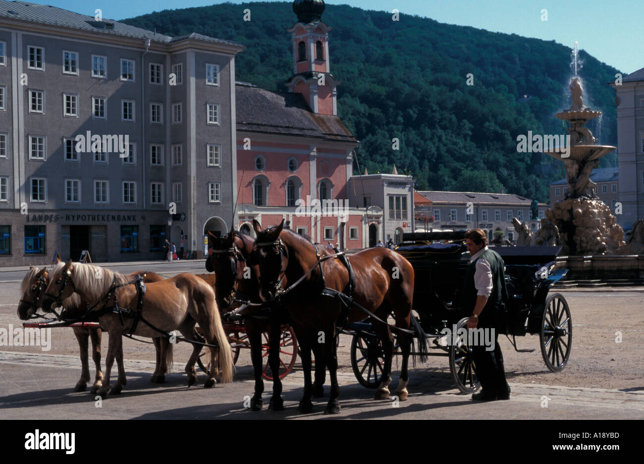 Horse drawn carriages waiting in Residenzplats Saltzburg Austria Stock Photo