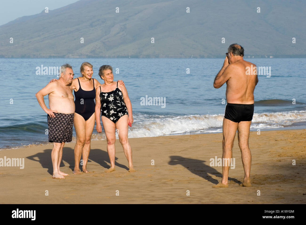Taking a Photograph on the Beach in Maui, Hawaii Stock Photo