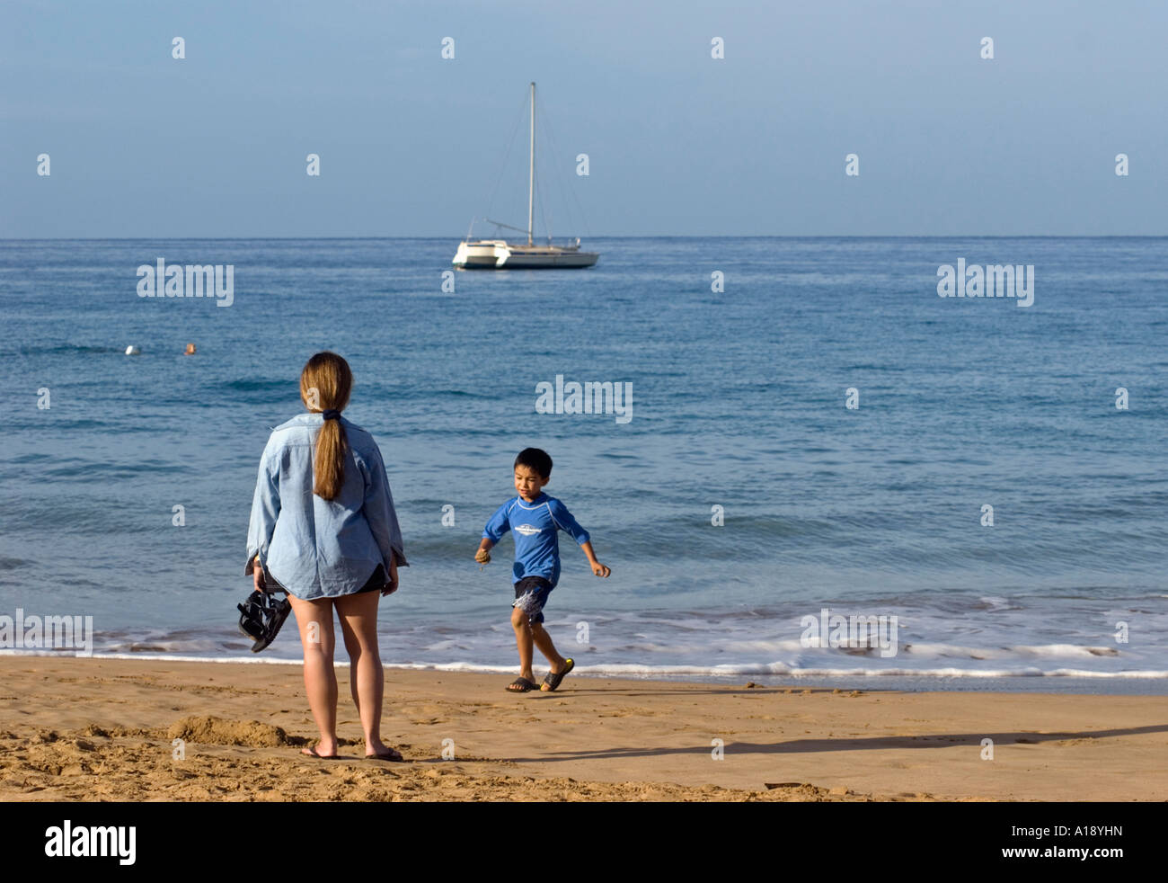 Mother and Son on Beach in Maui, Hawaii Stock Photo