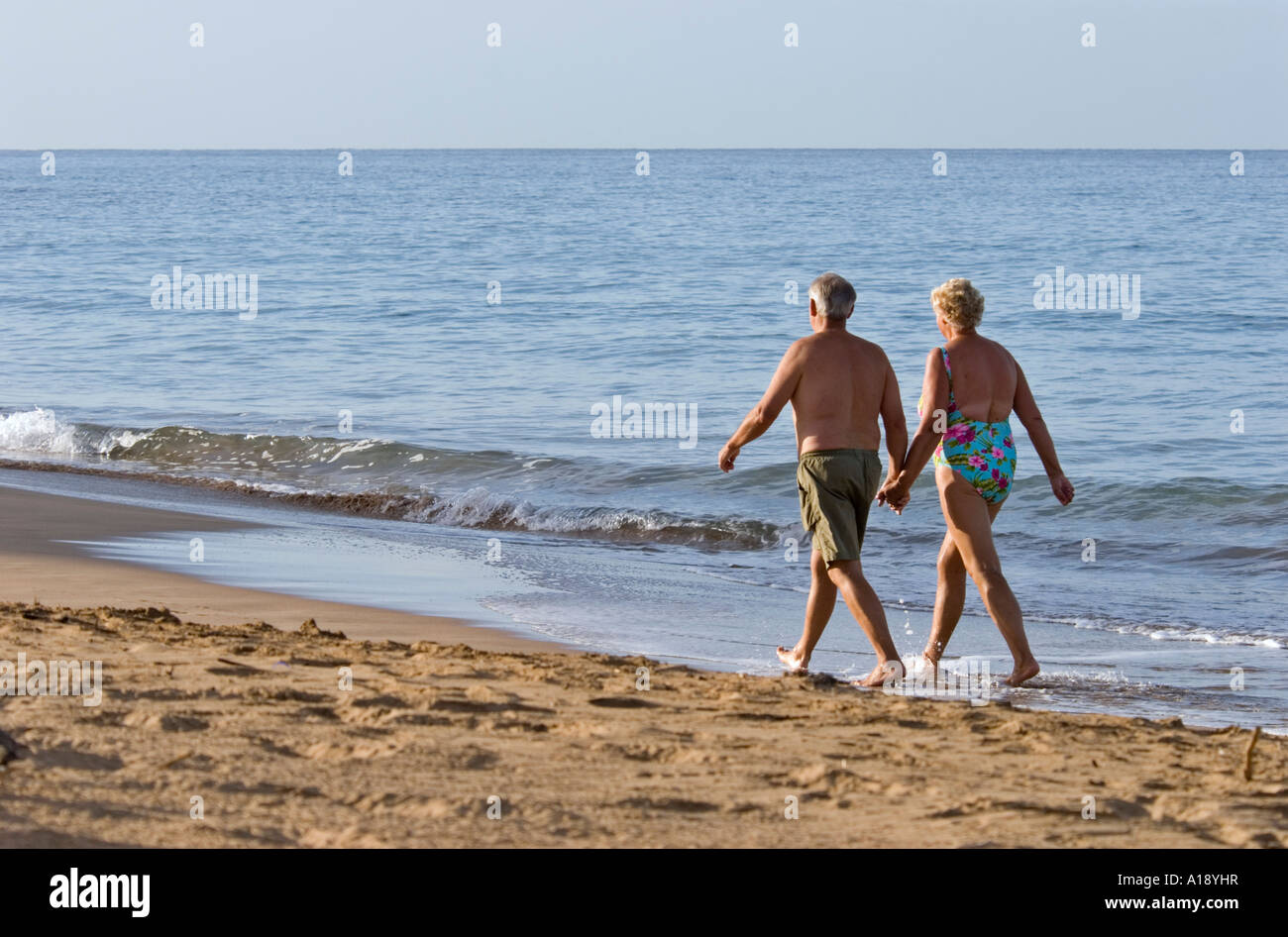 Mature couple walking on the beach in Maui, Hawaii Stock Photo