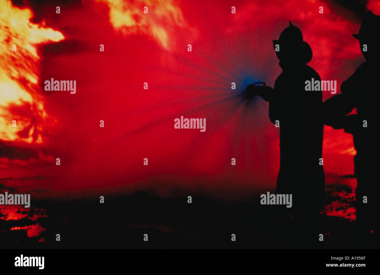 Silhouette of firefighter fighting fire Stock Photo - Alamy