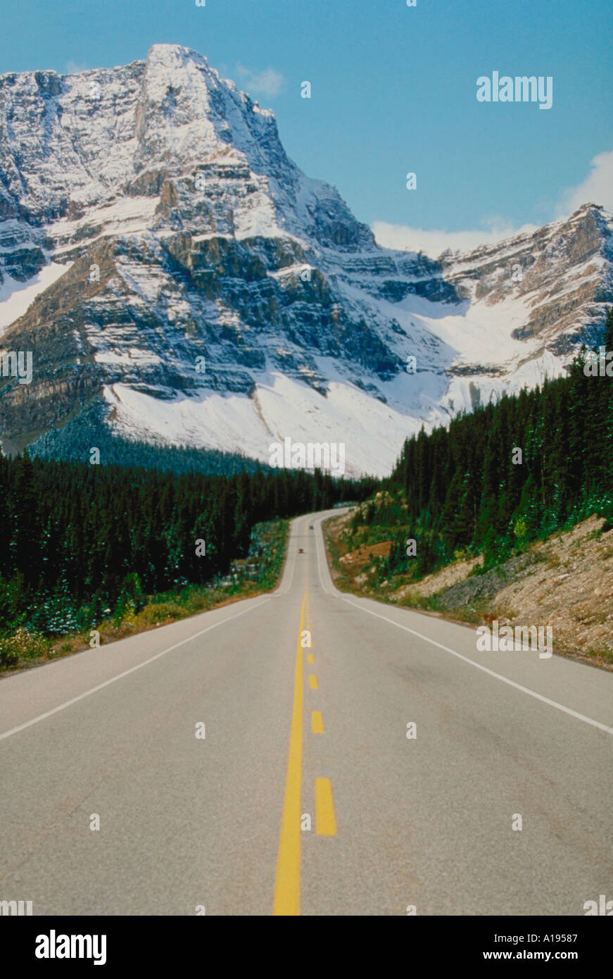 Road leading into mountains Stock Photo - Alamy