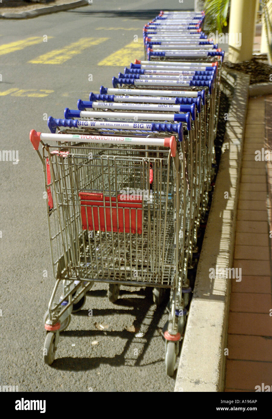 A row of empty supermarket trolleys / carts in a shopping centre car