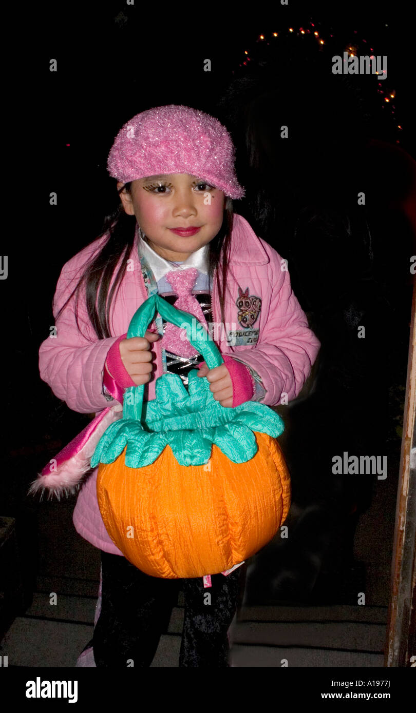 Asian Halloween trick and treater in pink with fabric pumpkin girl age