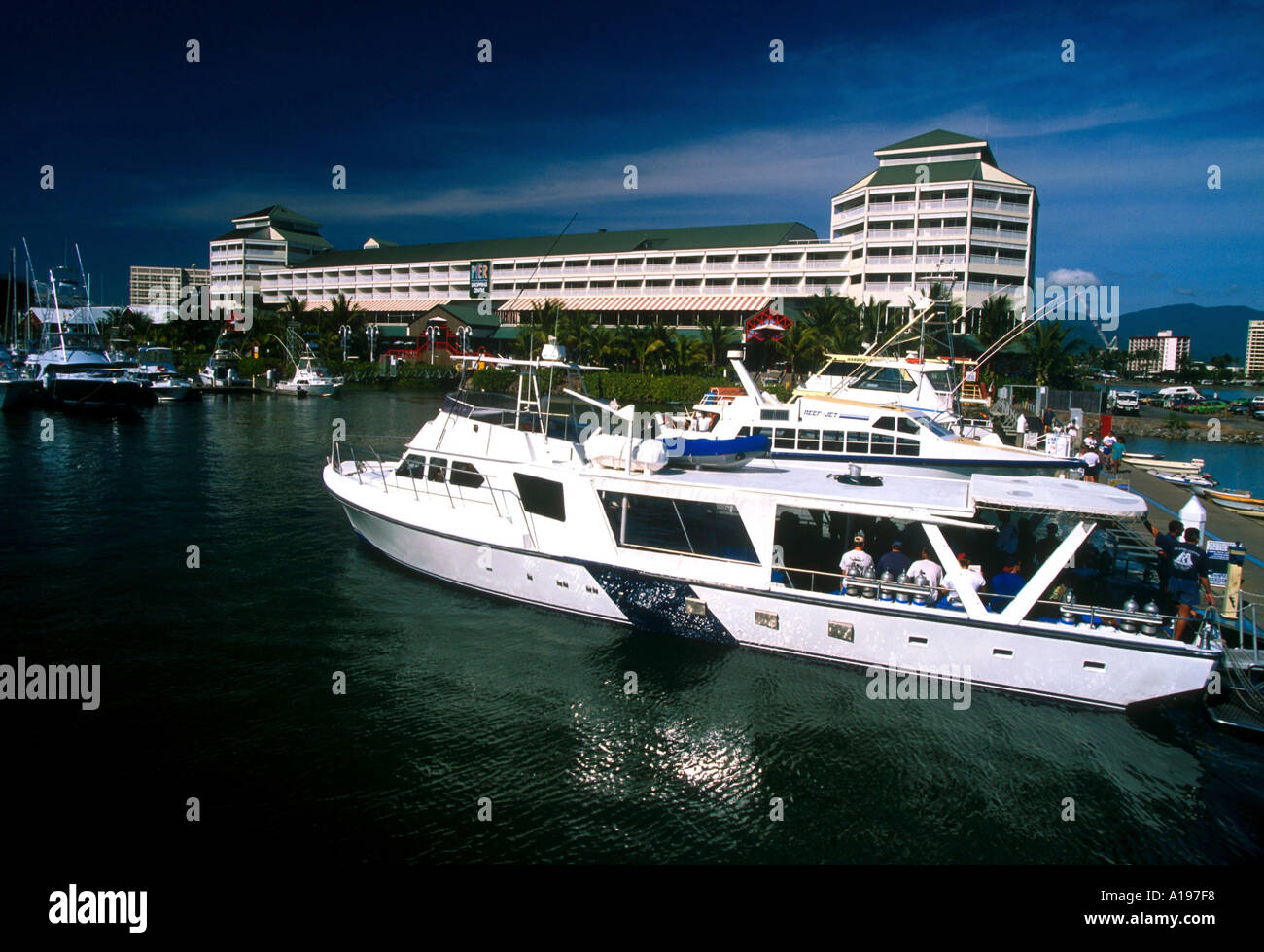 Tourist boat in harbour Cairns Queensland Australia R Francis Stock