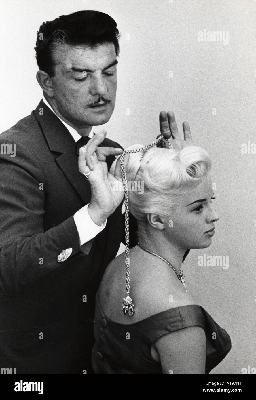 DIANA DORS UK film actress  has her hair styled in 1956 by London stylist Raymond Bessone known as Mr Teasy Weasy Stock Photo