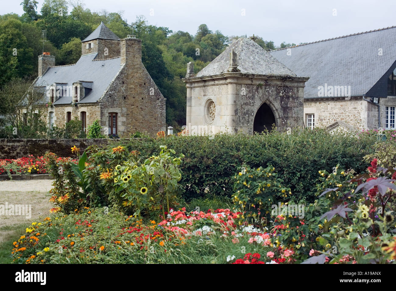 Flowerbeds and houses, Léhon, Brittany, France Stock Photo Alamy