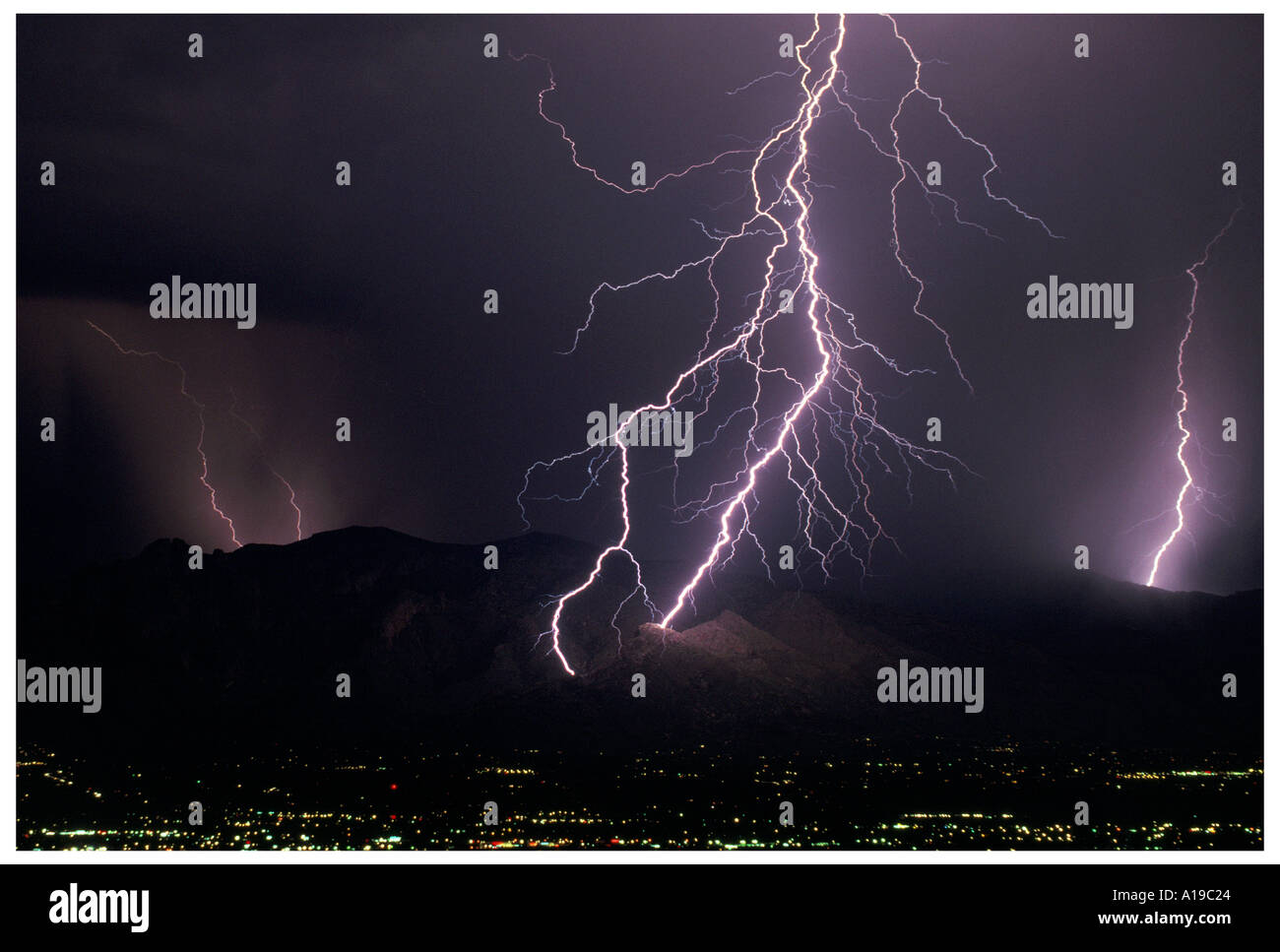 Lightning Strike with Upward Streamer in Catalina Mountains Stock Photo